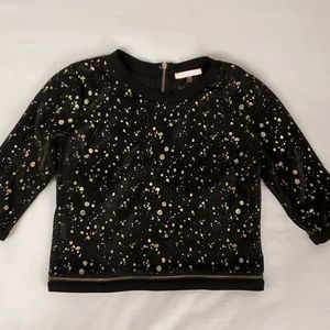 Black with gold paint splotches